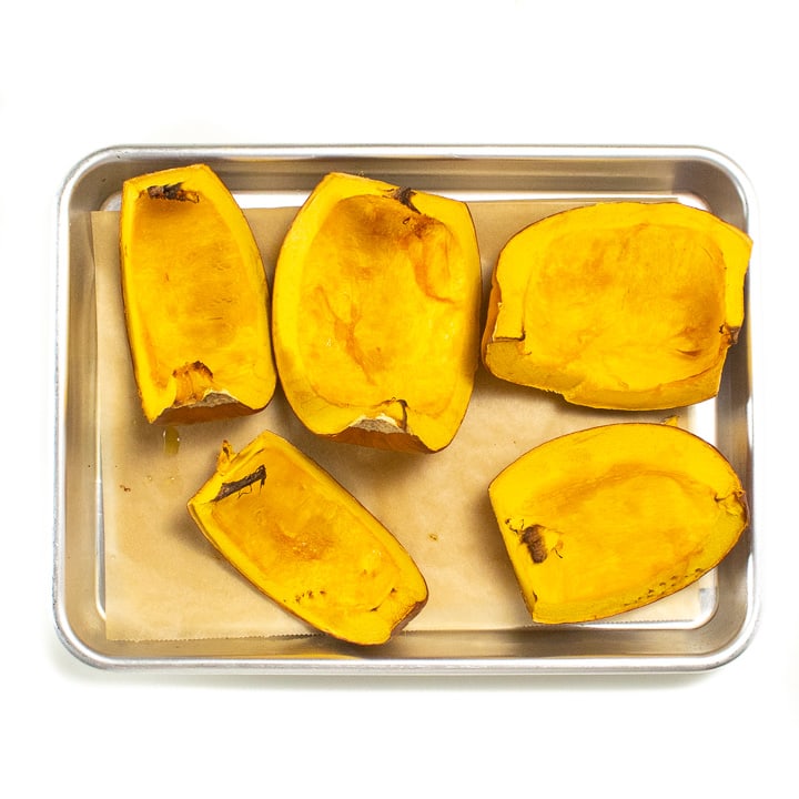 Roasted pumpkin on a baking sheet.