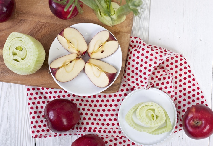 Produce spread around a cutting board.