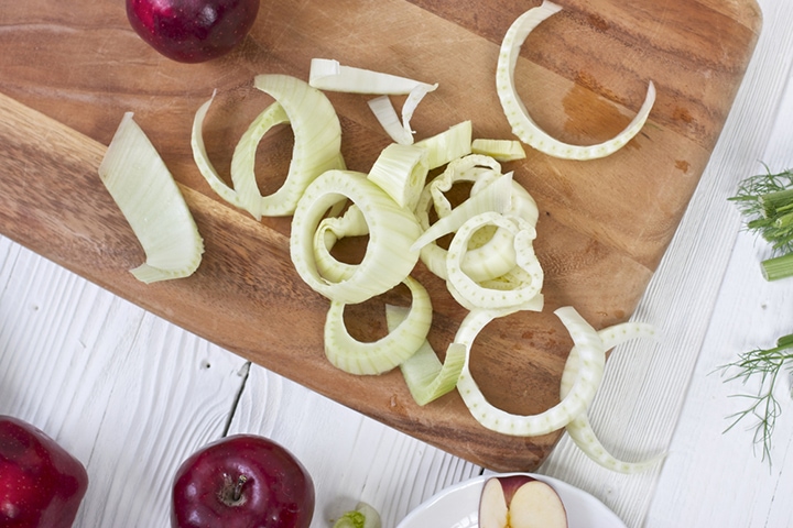Produce spread around a cutting board.
