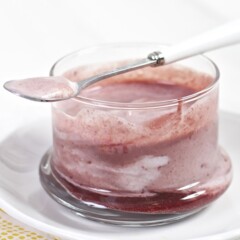 Clear cup with a baby food puree and yogurt inside.