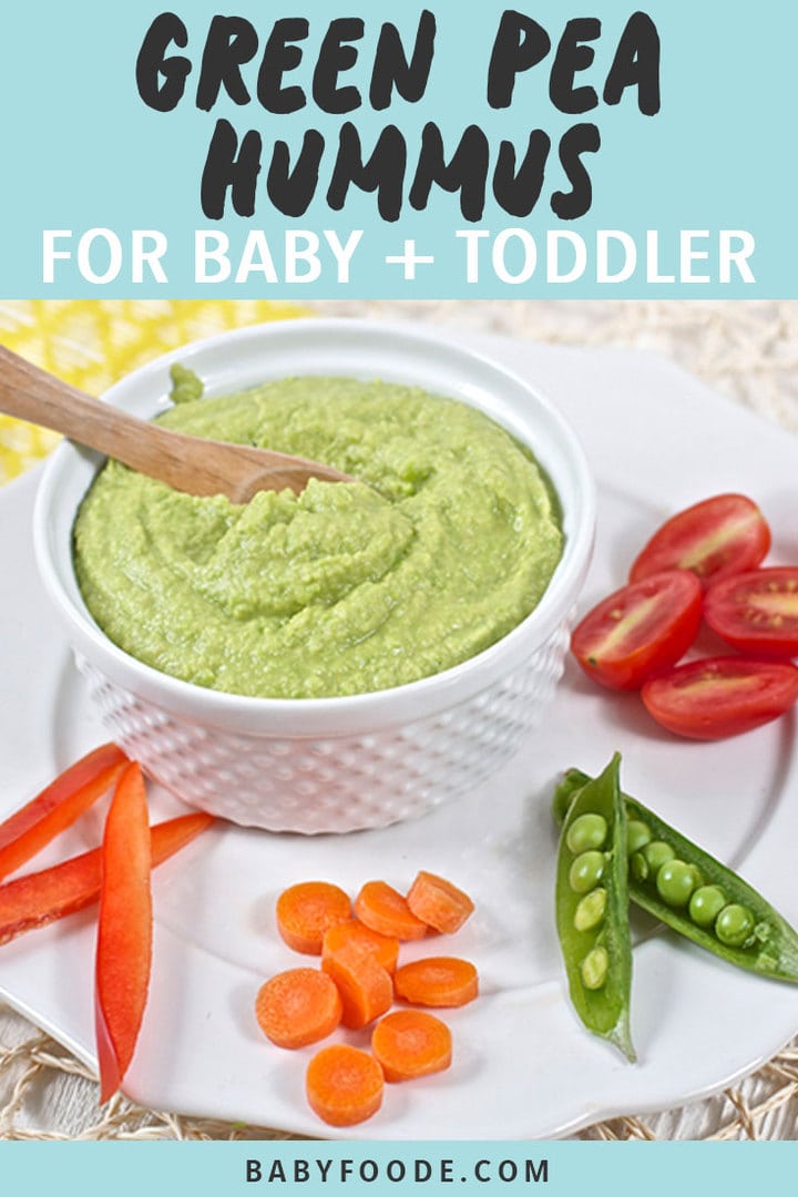 Graphic for Post - Green Pea Hummus for Baby + Toddler. Image is of a small bowl filled with hummus on a plate with chopped veggies.