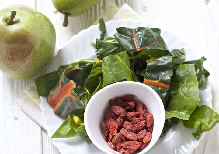 Spread of produce - chard, pears and goji berries.