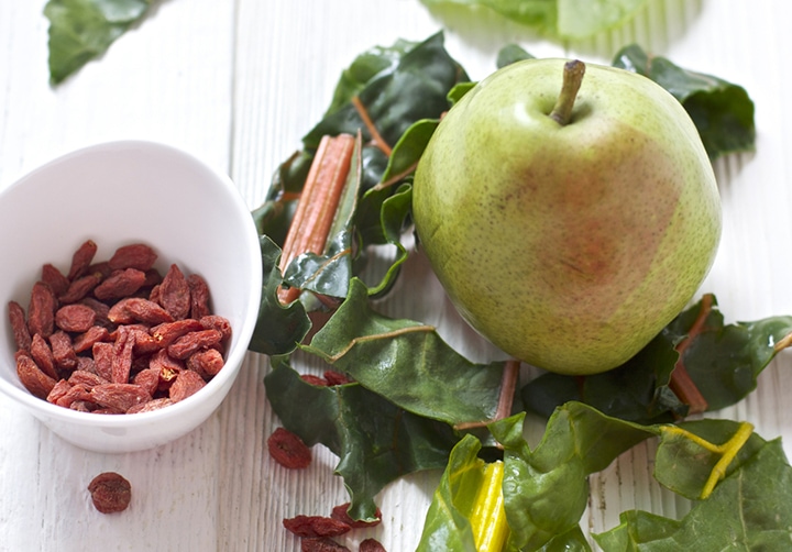 Spread of produce - chard, pears and goji berries.