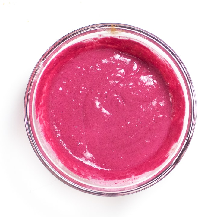 bowl with pink pancake batter mixed and ready to cook.
