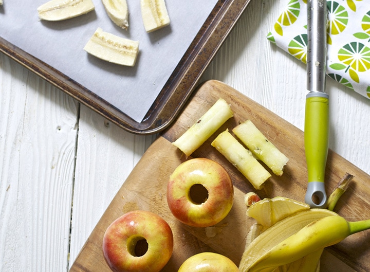 Produce on a white board and baking sheet.