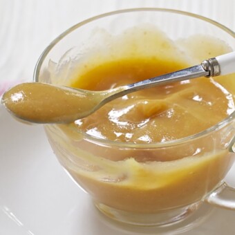 Small clear bowl filled with a thick and creamy homemade baby food puree.