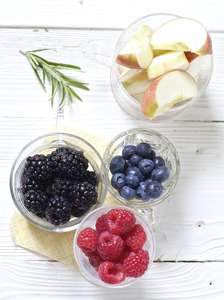 Spread of glass bowls filled with produce .