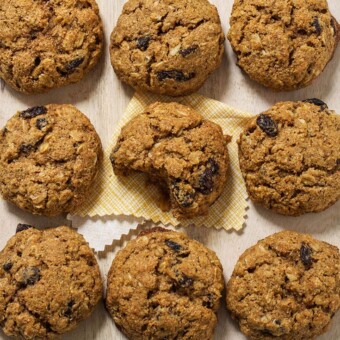 Pumpkin oatmeal cookies arranged in a square on a white background.