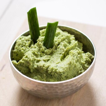 A bowl of toddler and kid friendly avocado and edamame dip.