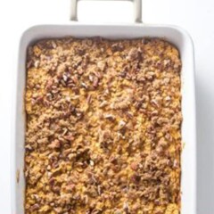 Baked pumpkin oatmeal in a white baking dish.