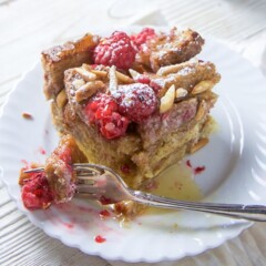 Raspberry French toast for the entire family on a small white plate.