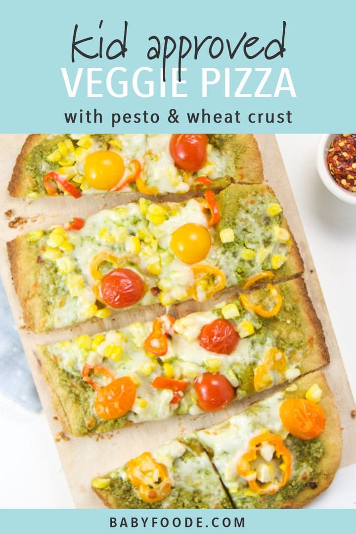 Whole wheat veggie pizza on a cutting board with side bowls of parmesan cheese and red pepper flakes.