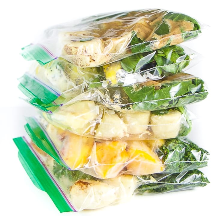 smoothie packs stacked on top of each other ready to be blended up.