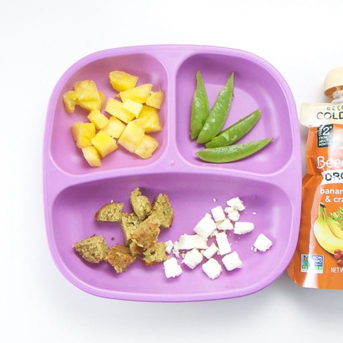 A healthy lunch for a toddler on a purple plate.