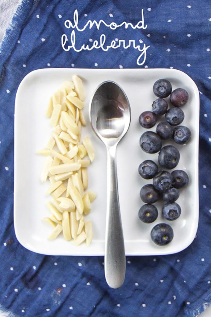 plate of toppings for oatmeal muffin cups for baby, toddler and kids - almond blueberry