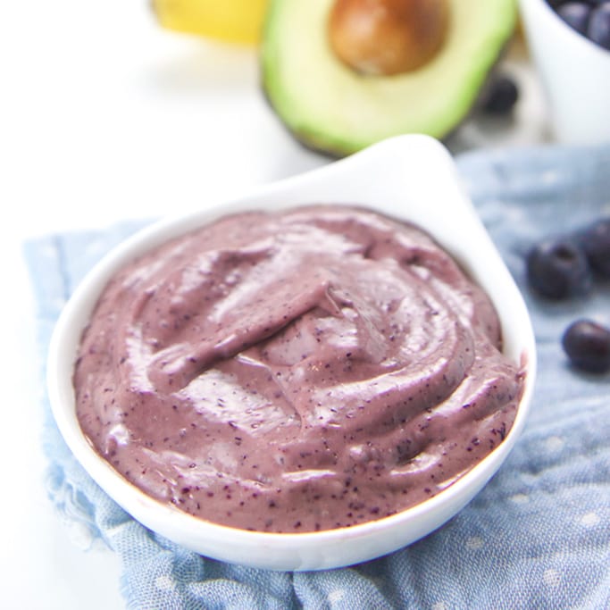 A small white bowl filled with baby food puree. 
