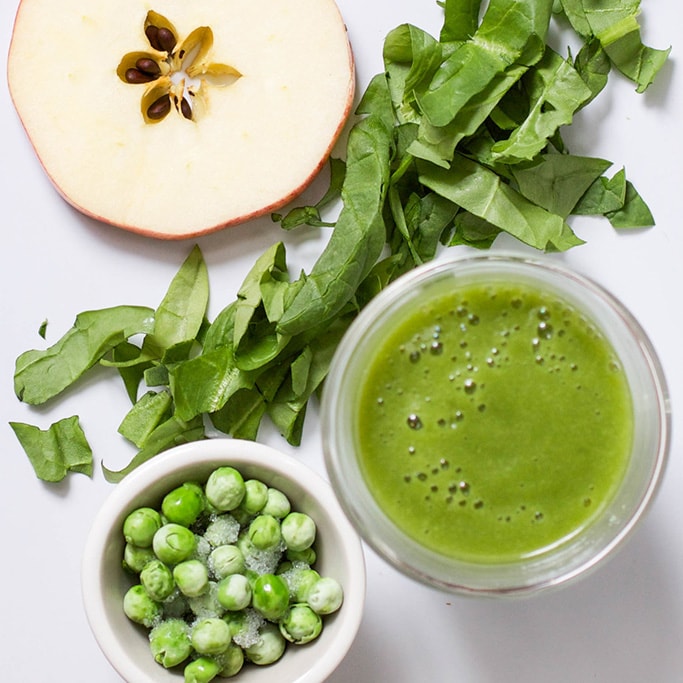 A spread of a green puree surrounded by the produce . 