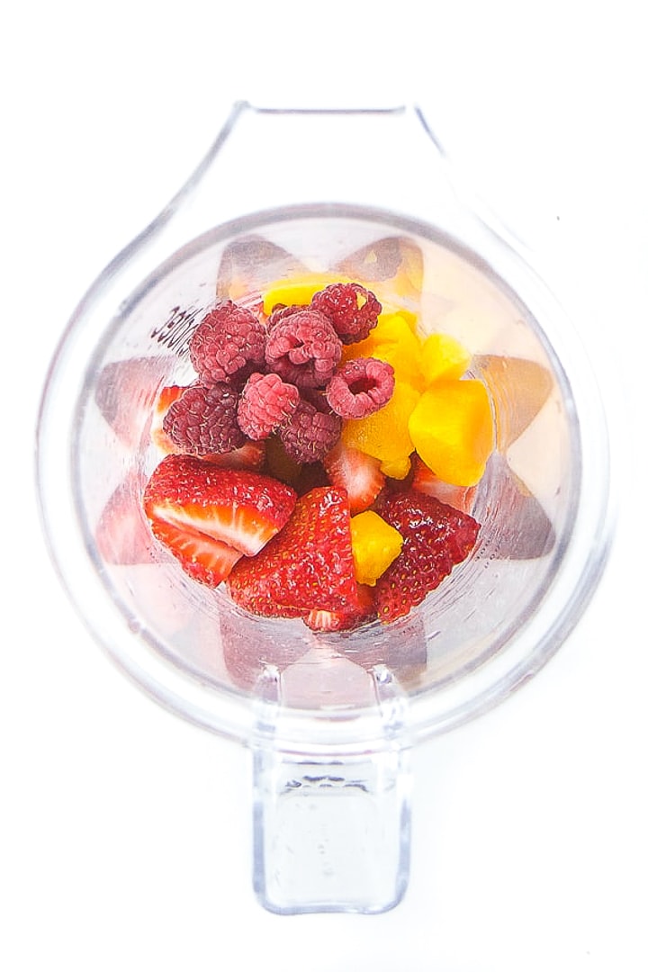 Blender full of ingredients for baby and toddler homemade popsicles.