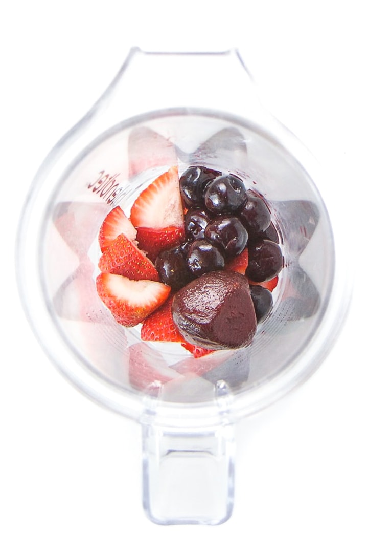 Blender full of ingredients for baby and toddler homemade popsicles.