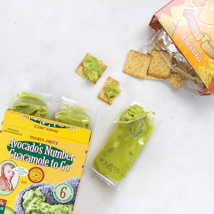 Toddler snack of avocado and crackers.