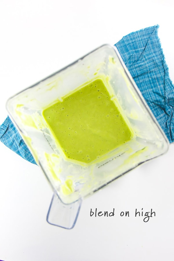 blender full of green smoothie for baby