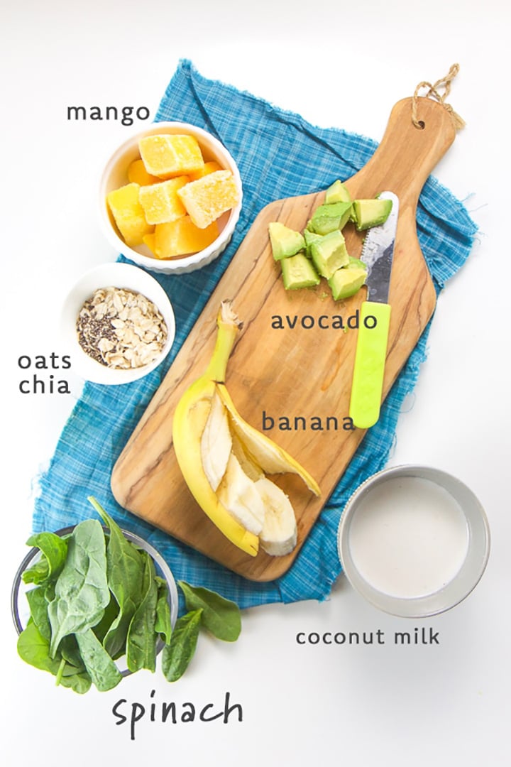 smoothie ingredients spread out on a cutting board