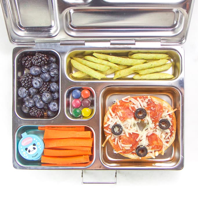 silver planetbox filled with bagel pizza, carrots, berries, dye-free candy.
