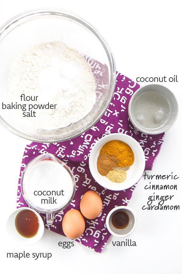 The ingredients for healthy golden milk waffles arranged on a white background.
