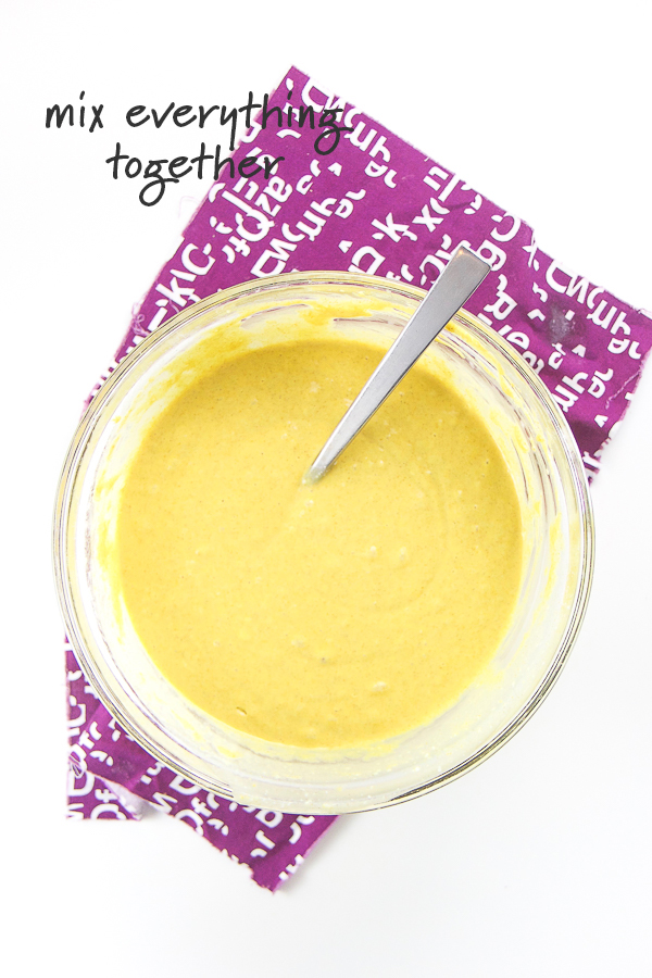 Golden milk waffle batter in a large mixing bowl.