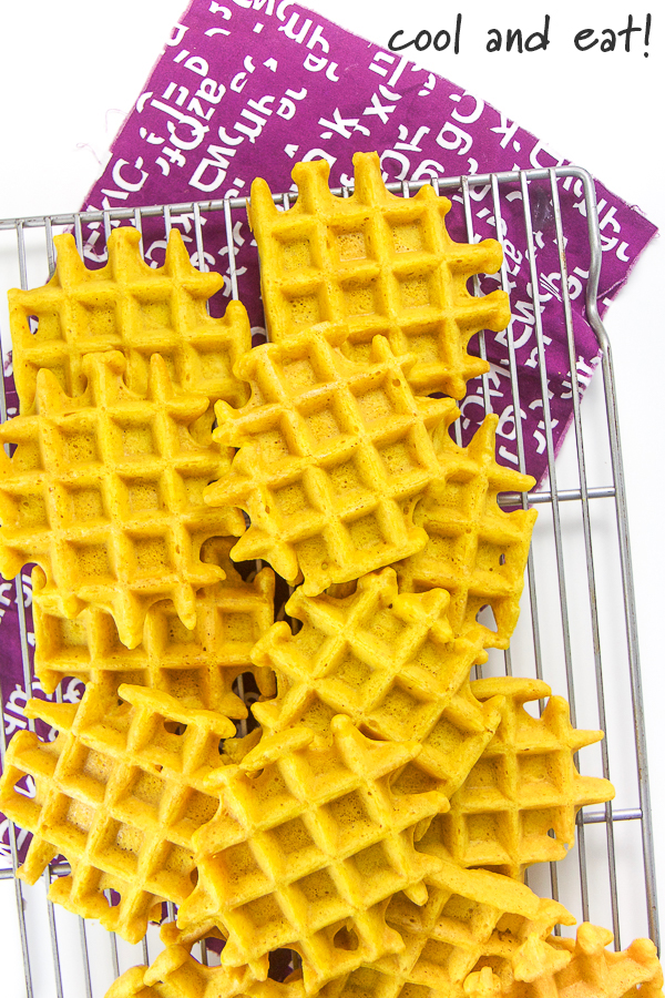 Golden milk waffles on a cooling rack.