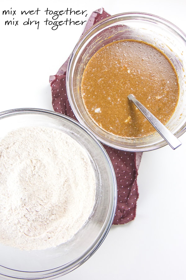 Wet ingredients and dry ingredients for gingerbread waffles mixed together in two separate bowls.