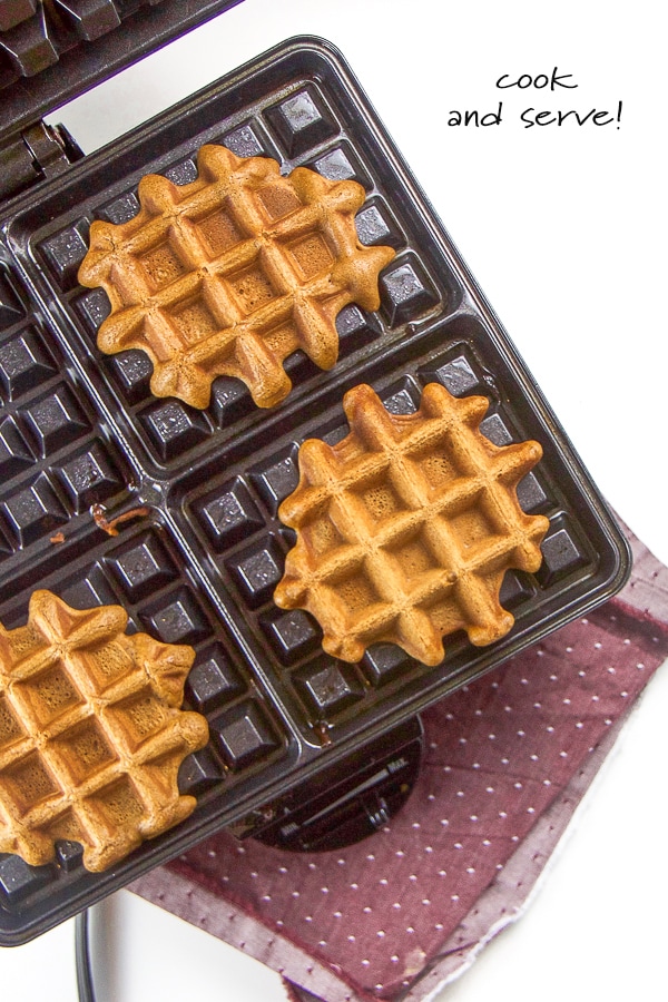 Healthy gingerbread waffles in a waffle maker.