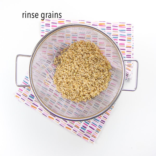 colander with all three grains in there after being rinsed with water.