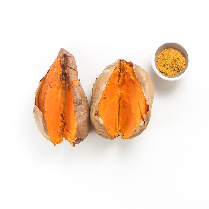 Cooked sweet potatoes cooked and cut open ready to puree.