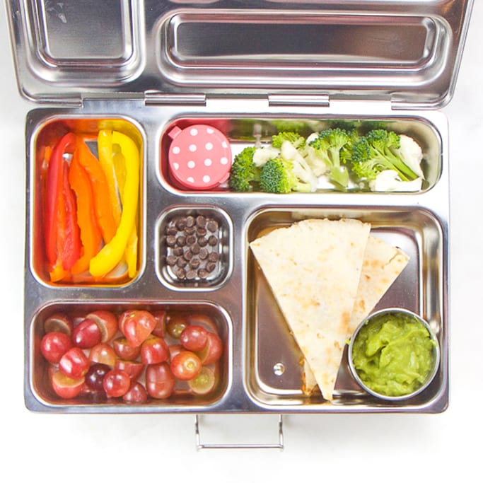 school lunch box silver planet box filled with allergy-free quesadilla, guacamole, broccoli, peppers, grapes and chocolate chips.