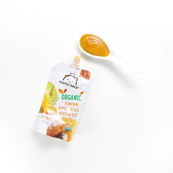 pouch with a spoon filled with it's puree - stage one