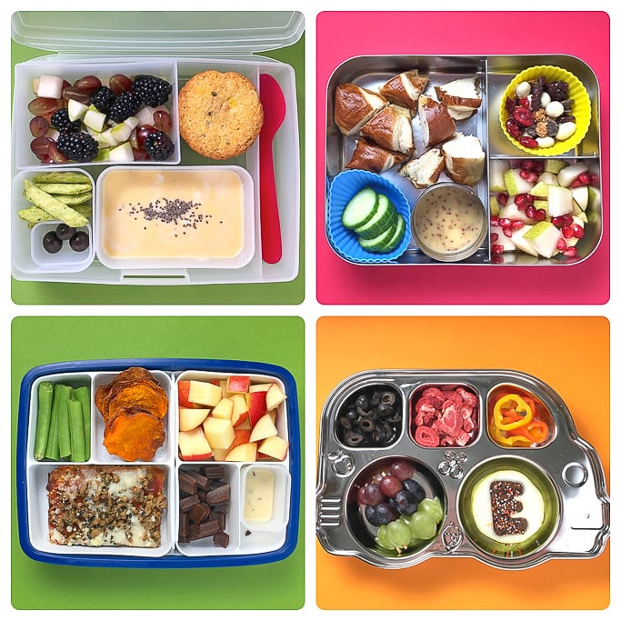 Four different bento boxes filled with healthy can colorful school lunches.