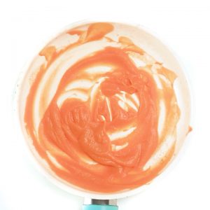 Saucepan filled with thawed baby food puree.