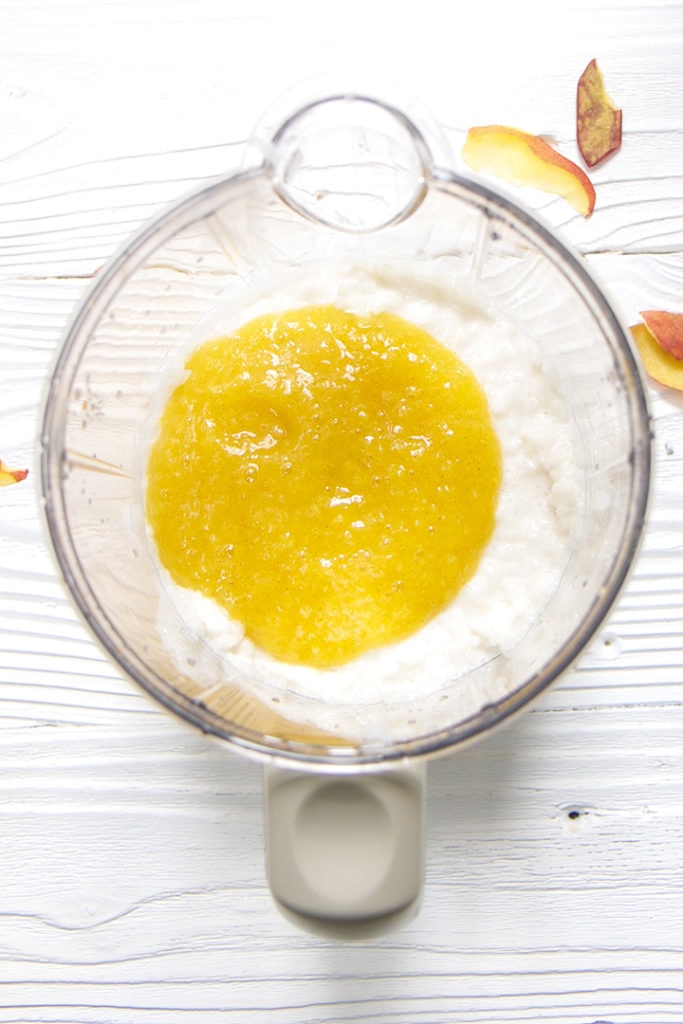 Cooked rice pudding with peach baby puree on top.