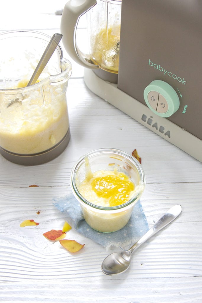 Blended peach rice pudding with a jar of style pudding in front of it.