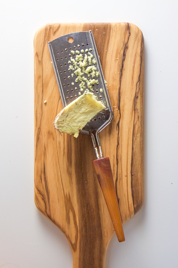 grated ginger on a cutting board.