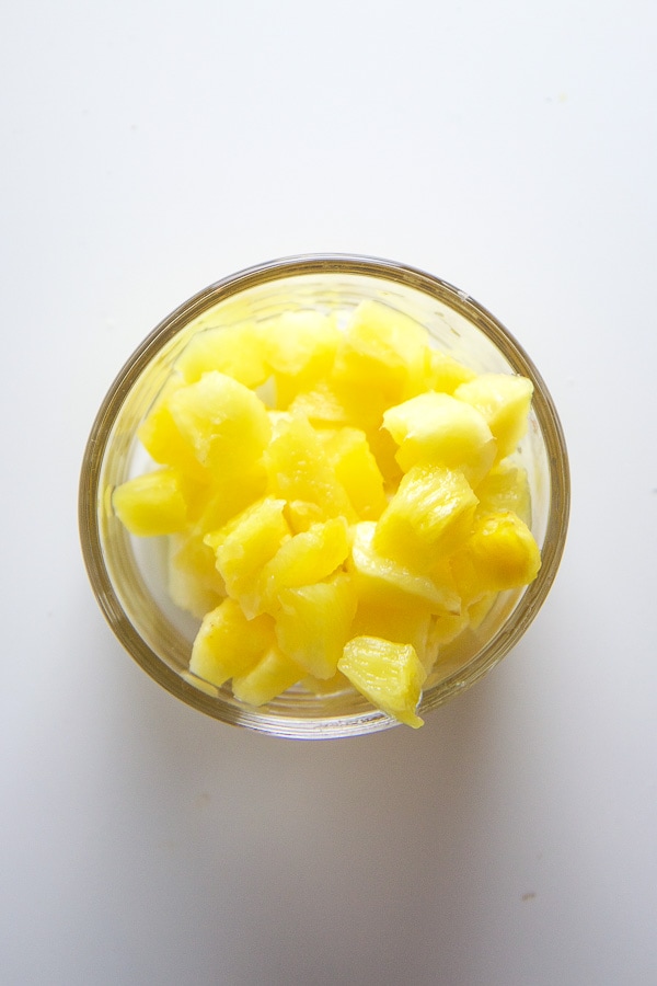 Small bowl of chopped pineapple.
