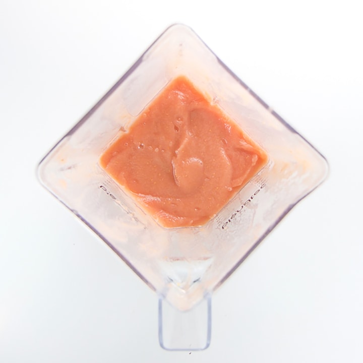 Blender full of homemade baby food puree.