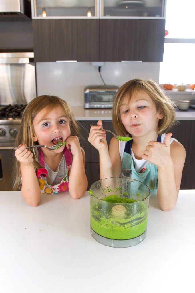 2 girls giving thumbs up for the recipe they made.