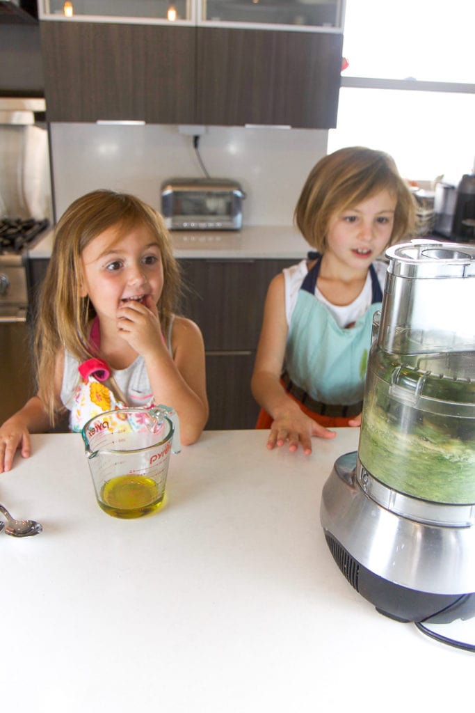 2 kids making a food recipe.
