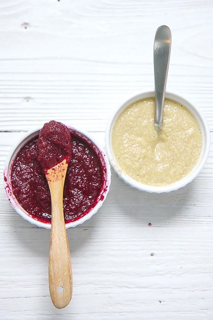 2 small white bowls full of summer baby food purees.