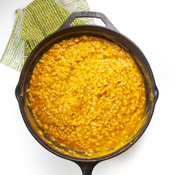kid friendly pumpkin risotto in a cast iron skillet - cooked and done.