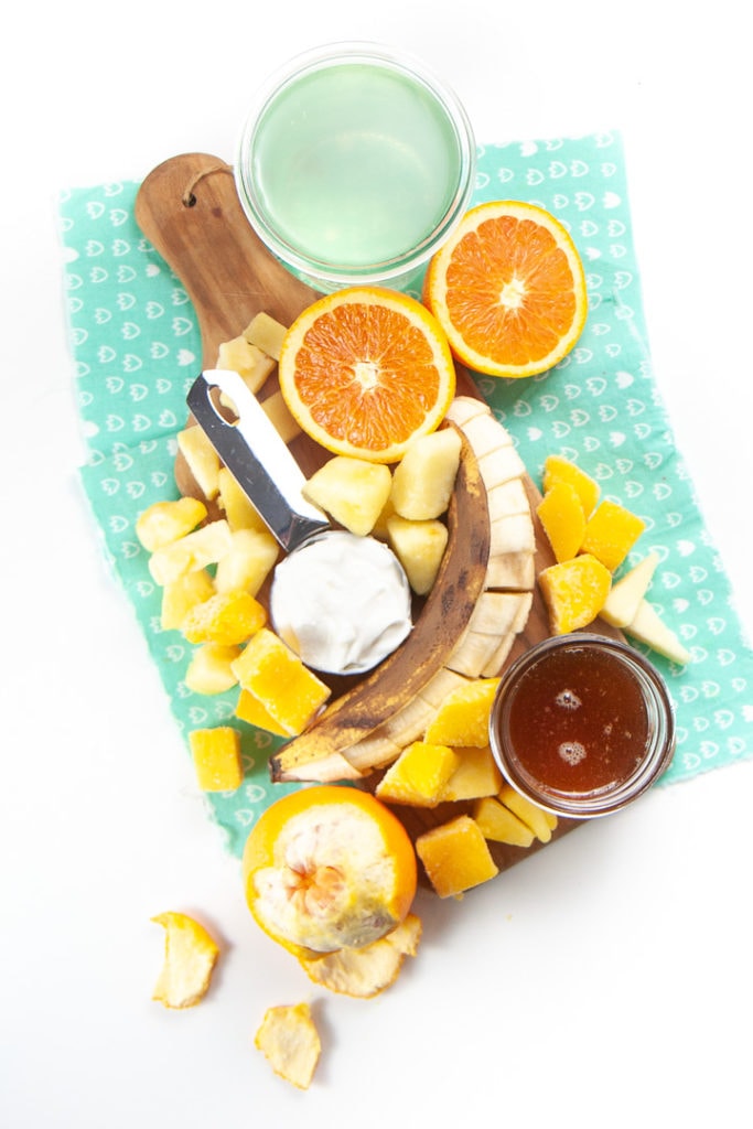Spread of cold busting produce on a blue napkin.