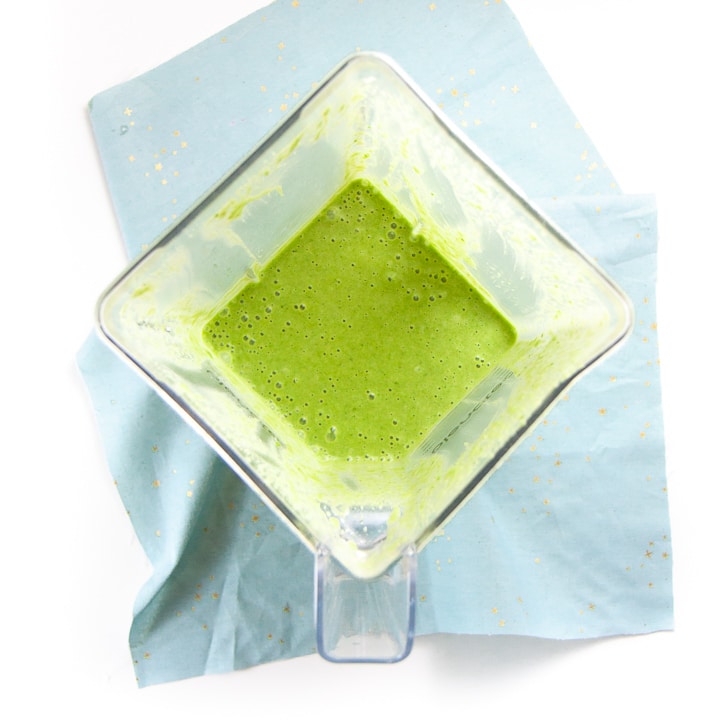 blender with green wet ingredients for muffins.