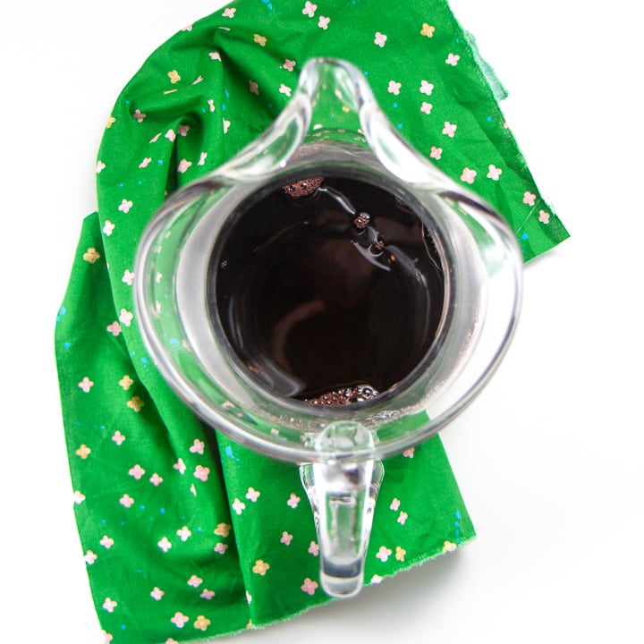 Clear pitcher filled with cherry juice
